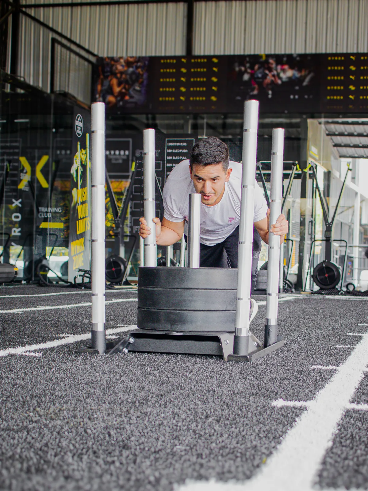 woman in red jersey shirt and white shorts holding baseball bat