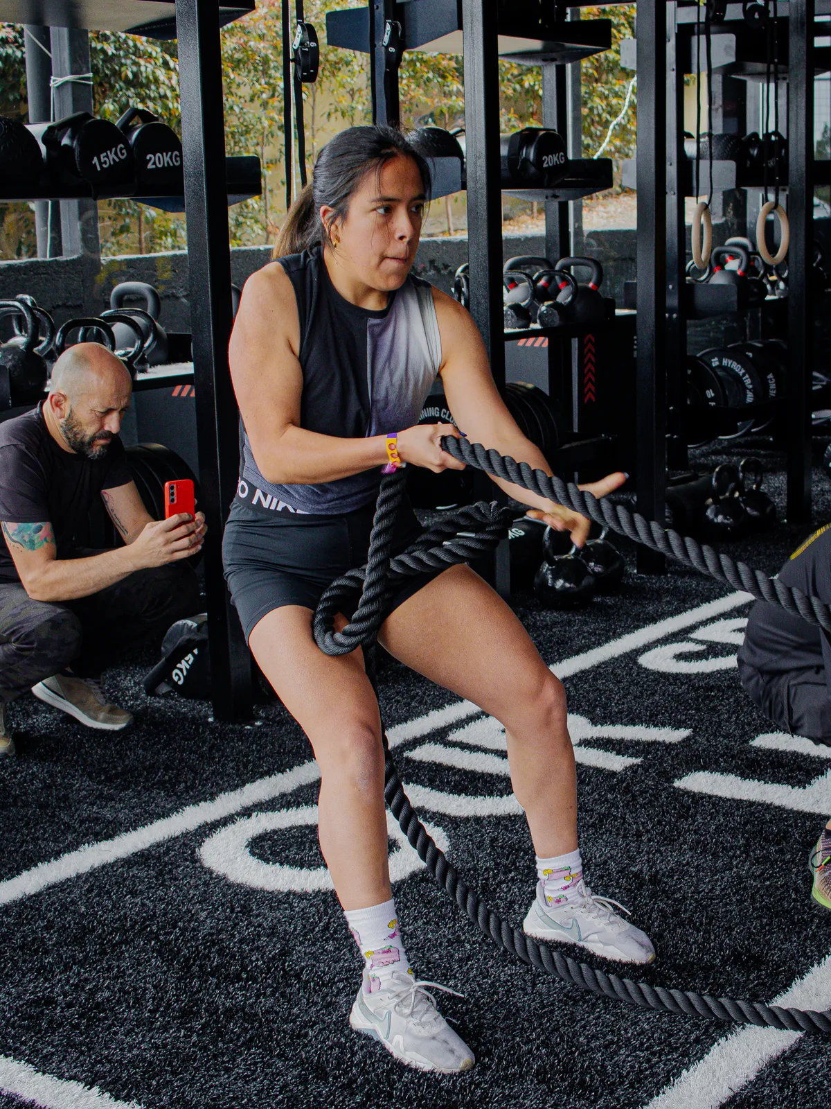 man wearing black jacket standing on street