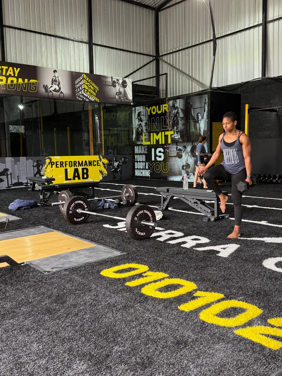 man holding dumbbells